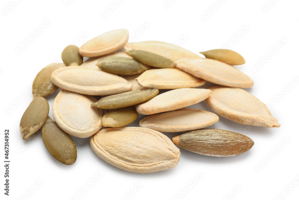 Pile of natural pumpkin seeds on white background