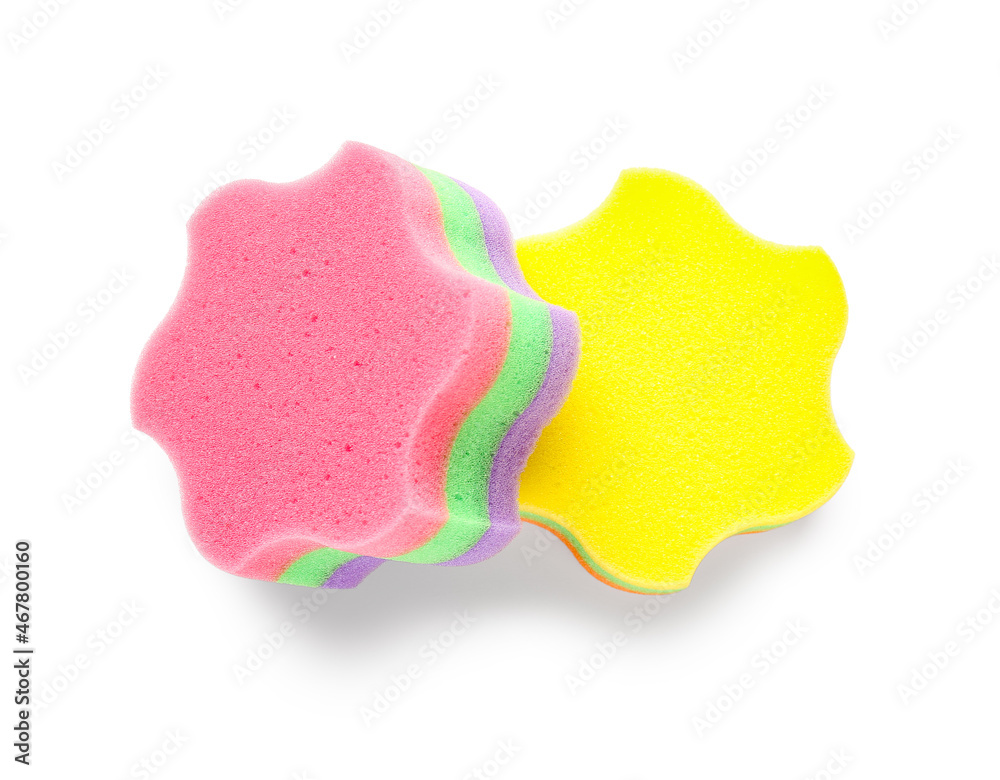 Different star shaped bath sponges on white background