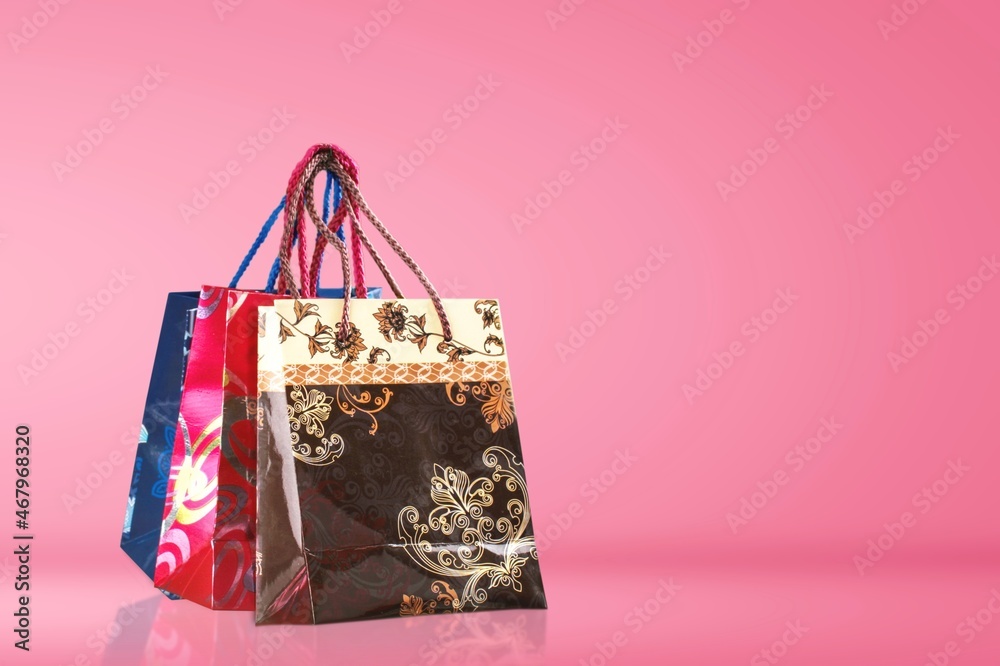 Paper shopping bag on color background. Shopping sale delivery concept