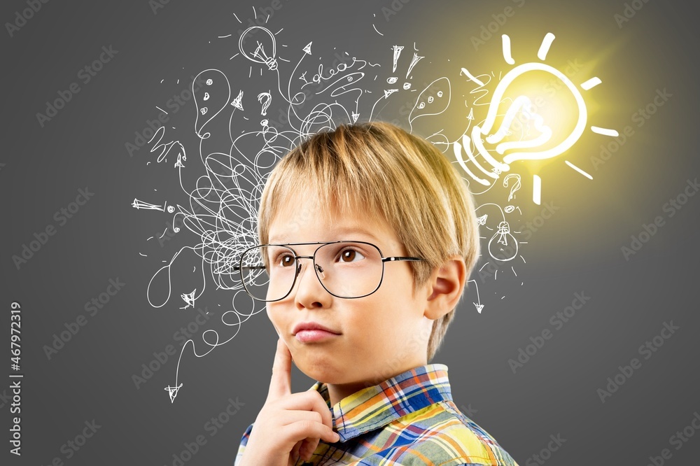 Thinking child boy with light bulb and question marks. Brainstorming and idea concept