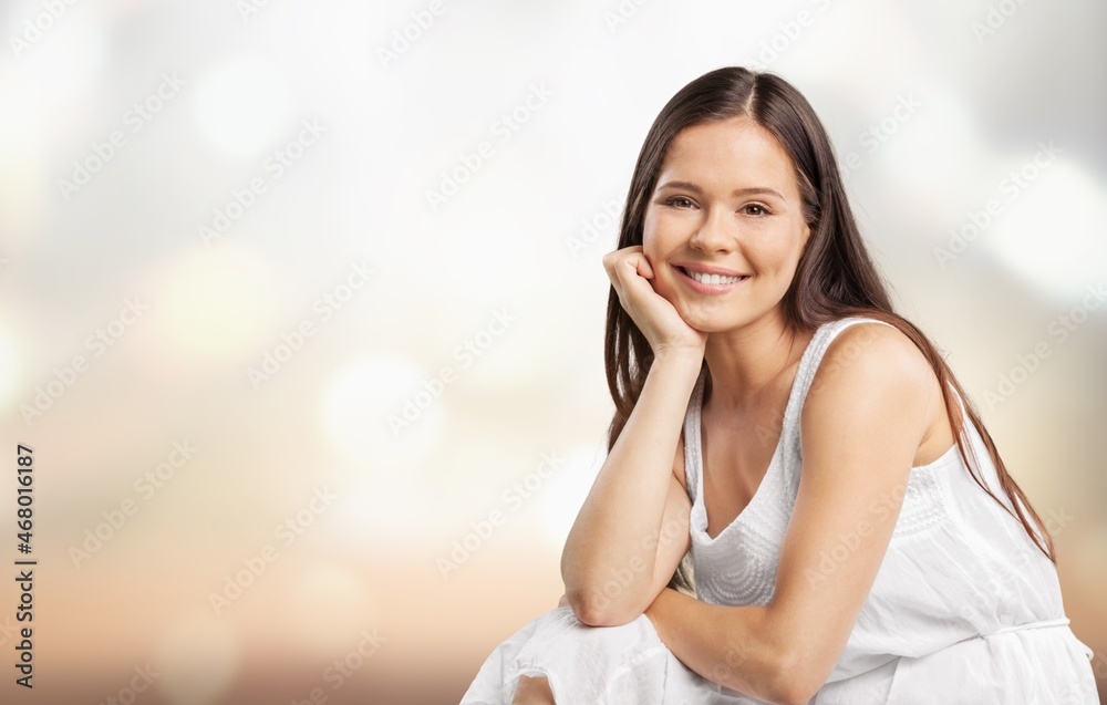 Young happy and positive woman smiling carefree,