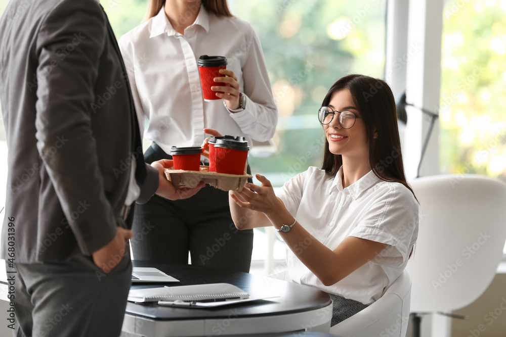 Business people having coffee break in office