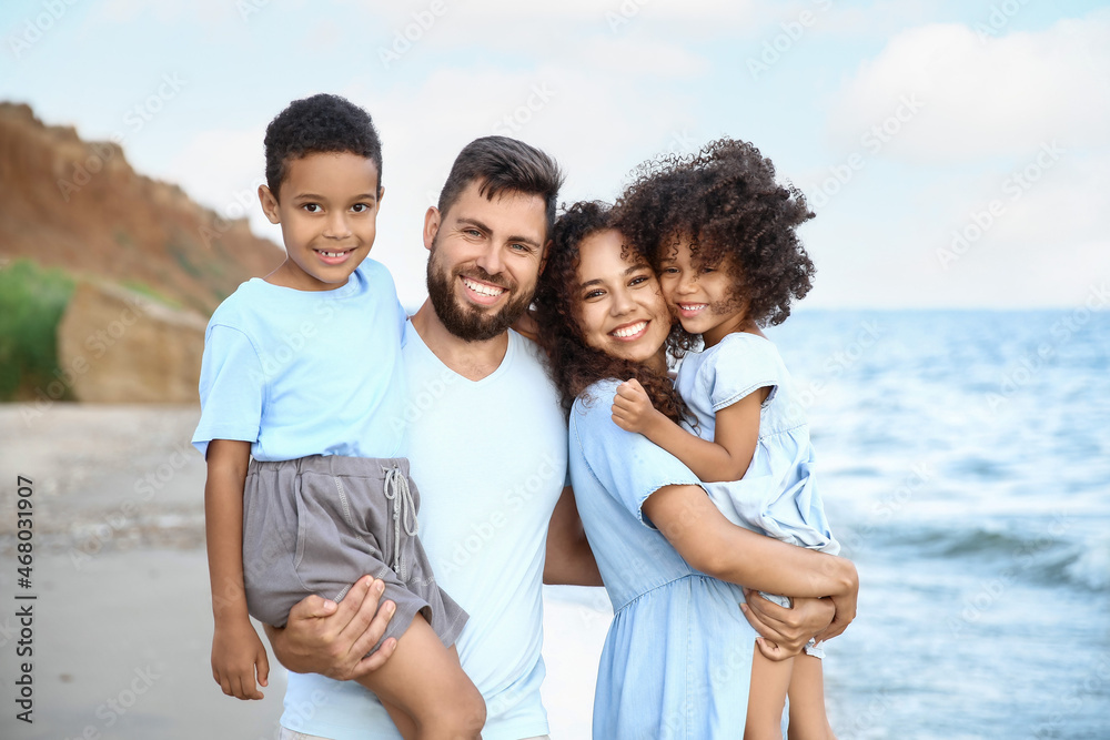 Happy family on sea beach