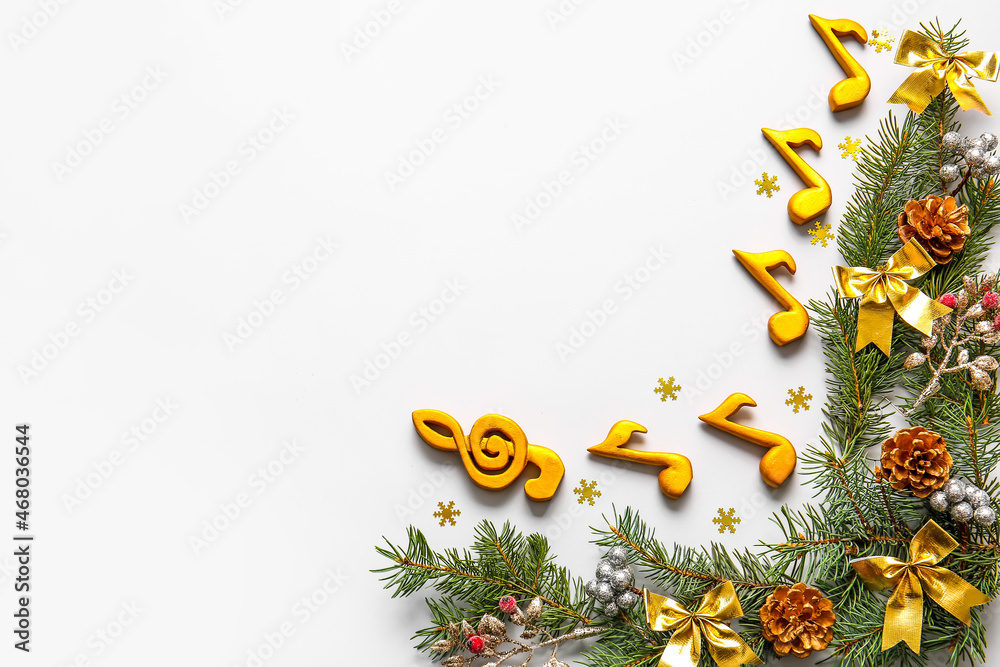 Note signs with Christmas decor and fir branches on light background