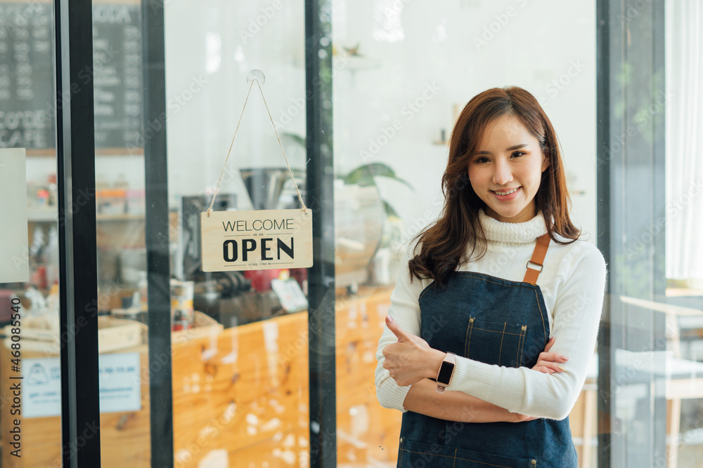 Portrait of Startup successful small business owner in coffee shop.handsome woman barista cafe owner