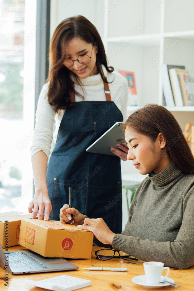 small business owner checking parcel box. entrepreneur seller preparing retail package postal shippi