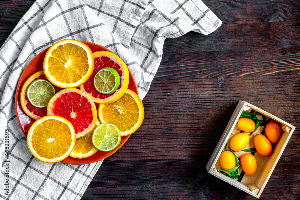 sliced citrus fruits on kitchen background top view mockup