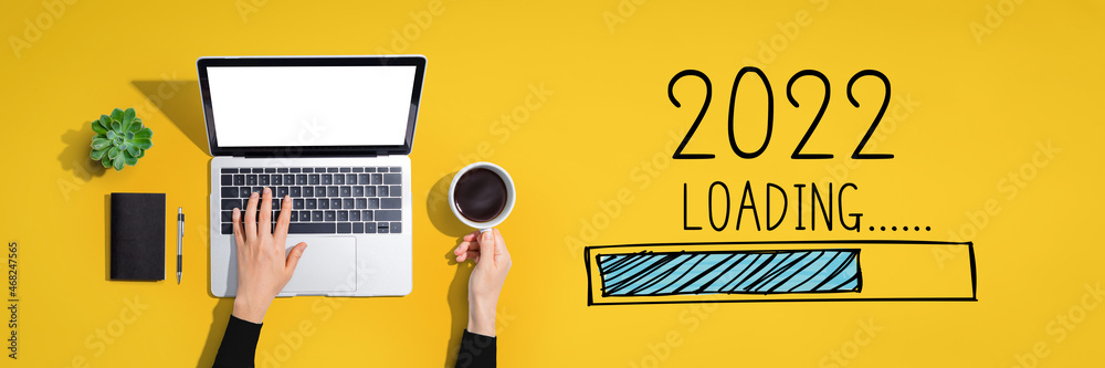 Loading new year 2022 with person using a laptop computer