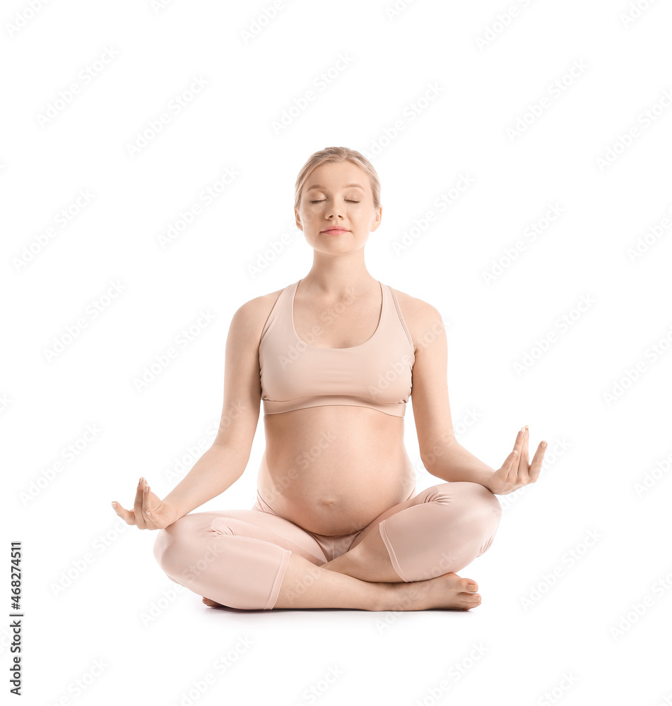 Young pregnant woman meditating on white background