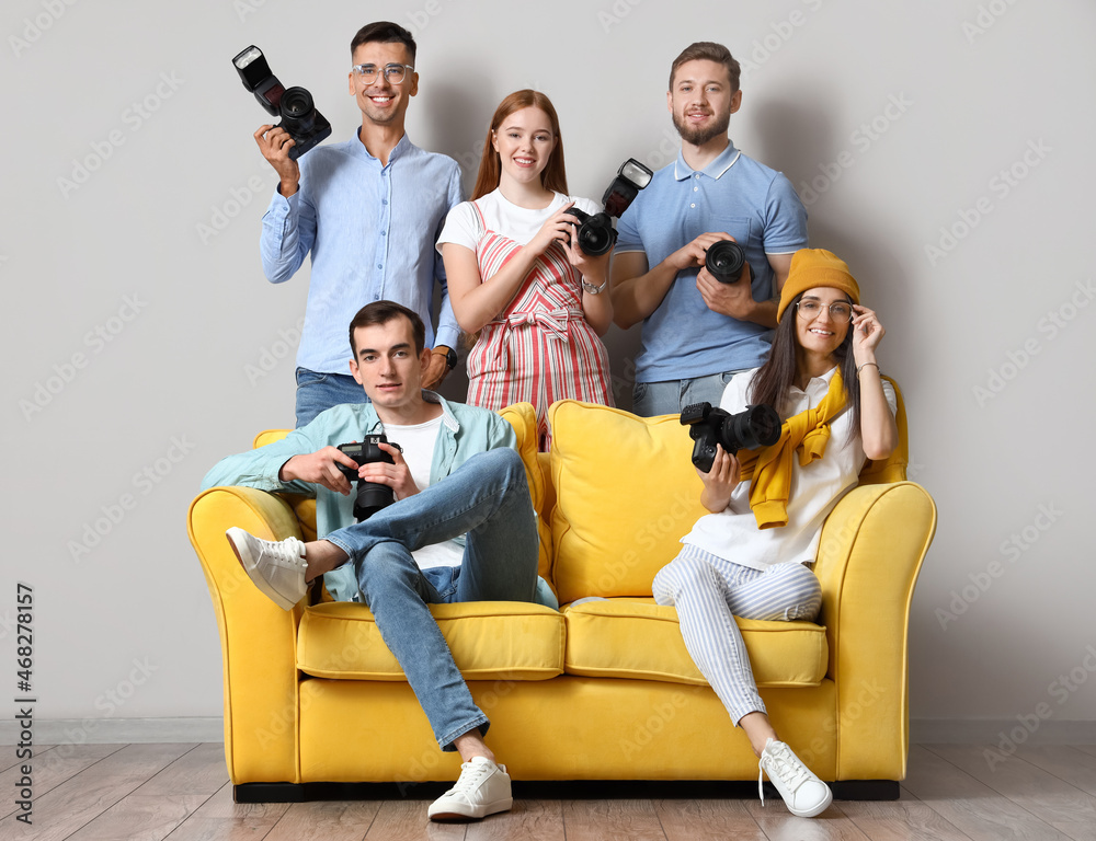 Group of young photographers during classes in studio