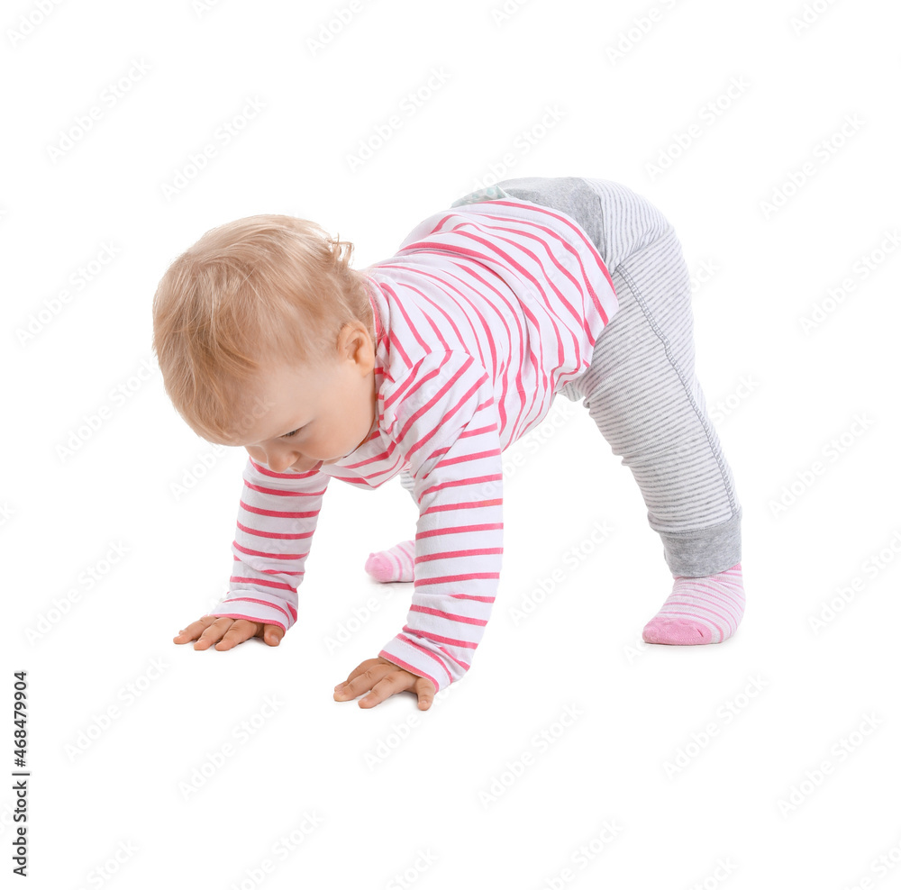 Cute baby girl learning to walk on white background