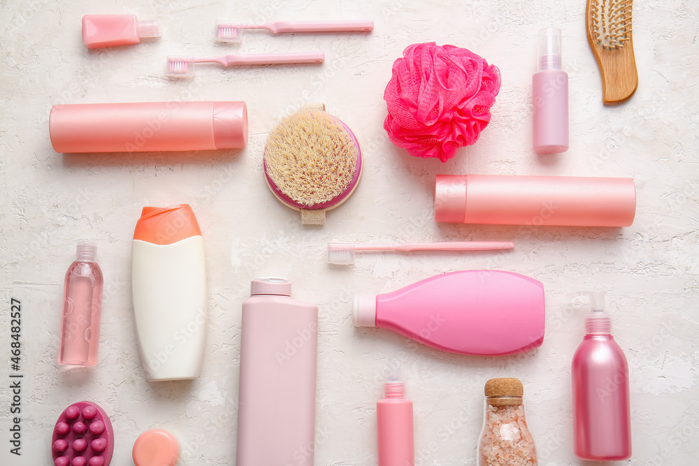 Different bath accessories and cosmetics on light background, closeup