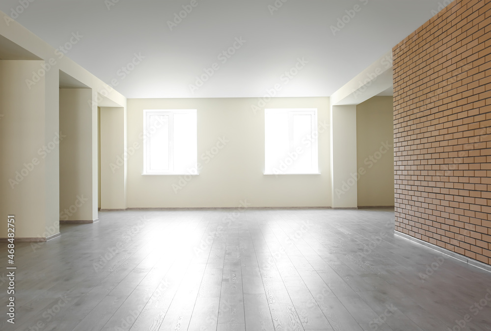 View of big empty room with windows