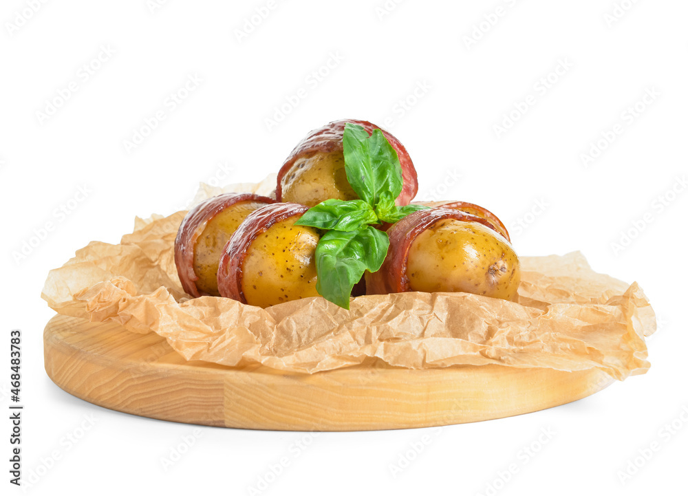 Wooden board of tasty baked potatoes with bacon on white background