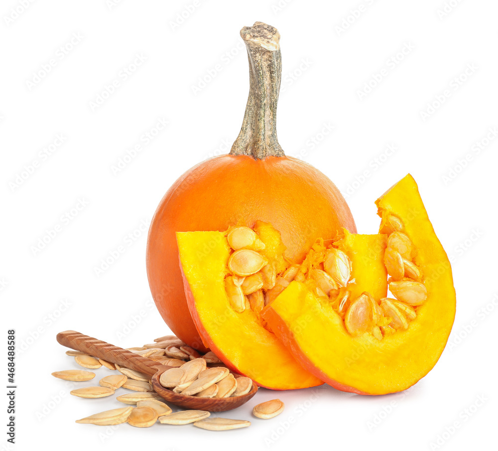 Natural pumpkin seeds and fresh vegetables on white background