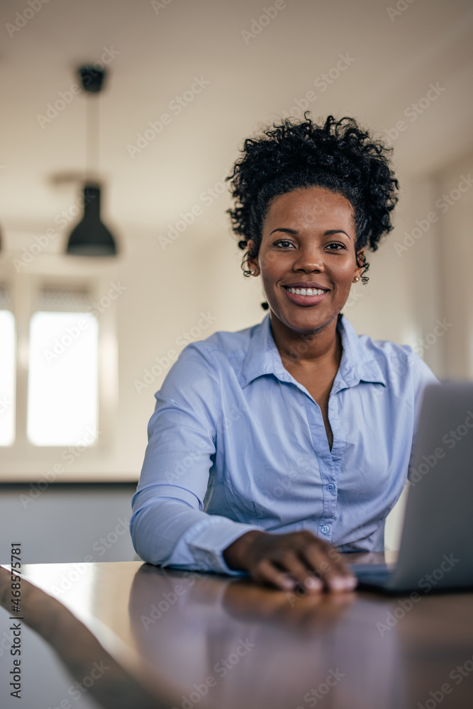 Postive african-american businesswoman, preparing for work