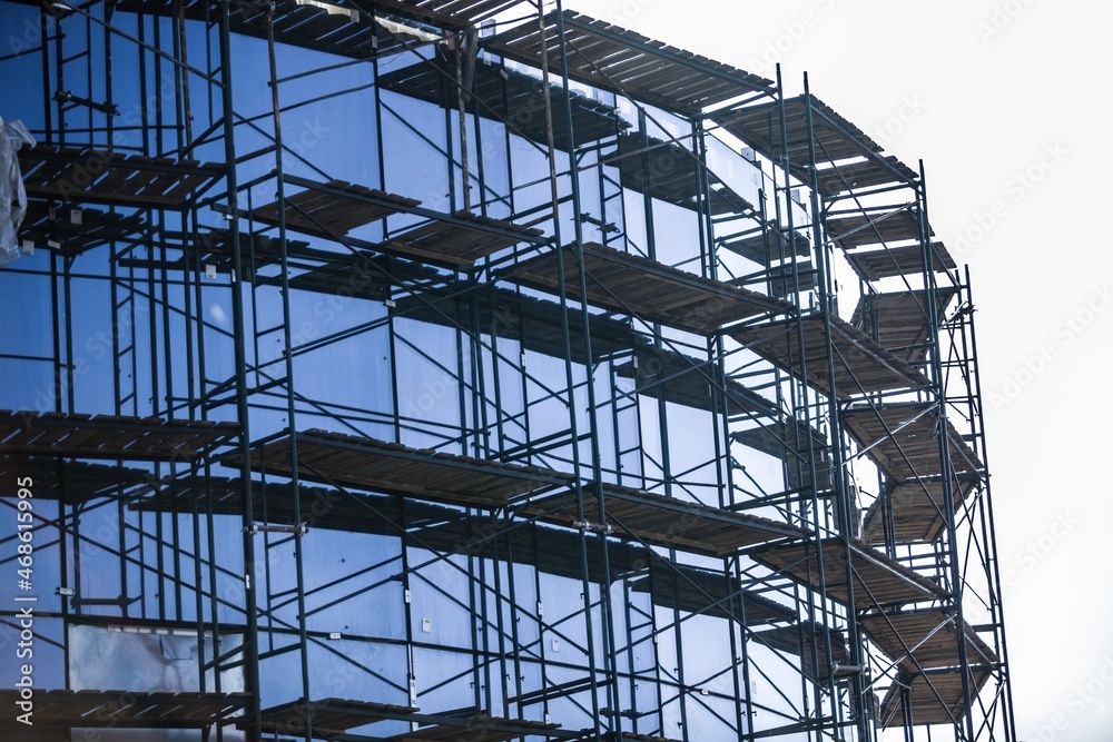 A new apartment block,Tall building under construction with scaffolds,Construction Site