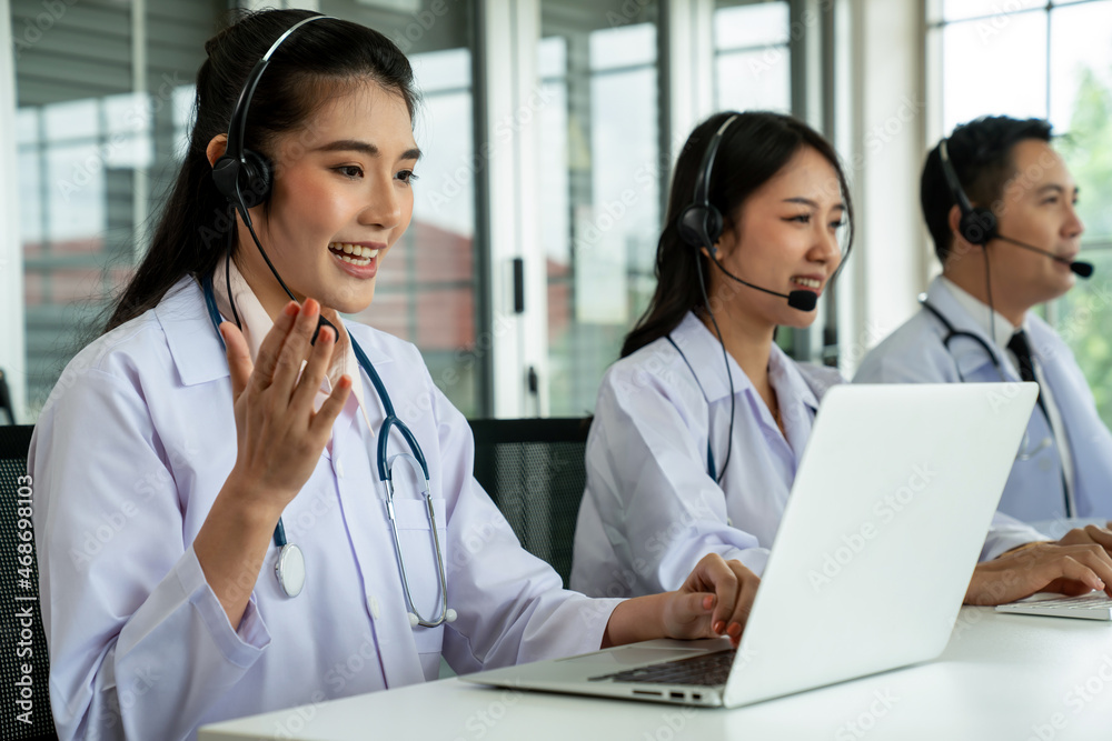 Doctor team wearing headset talking actively on video call in hospital clinic . Concept of telehealt