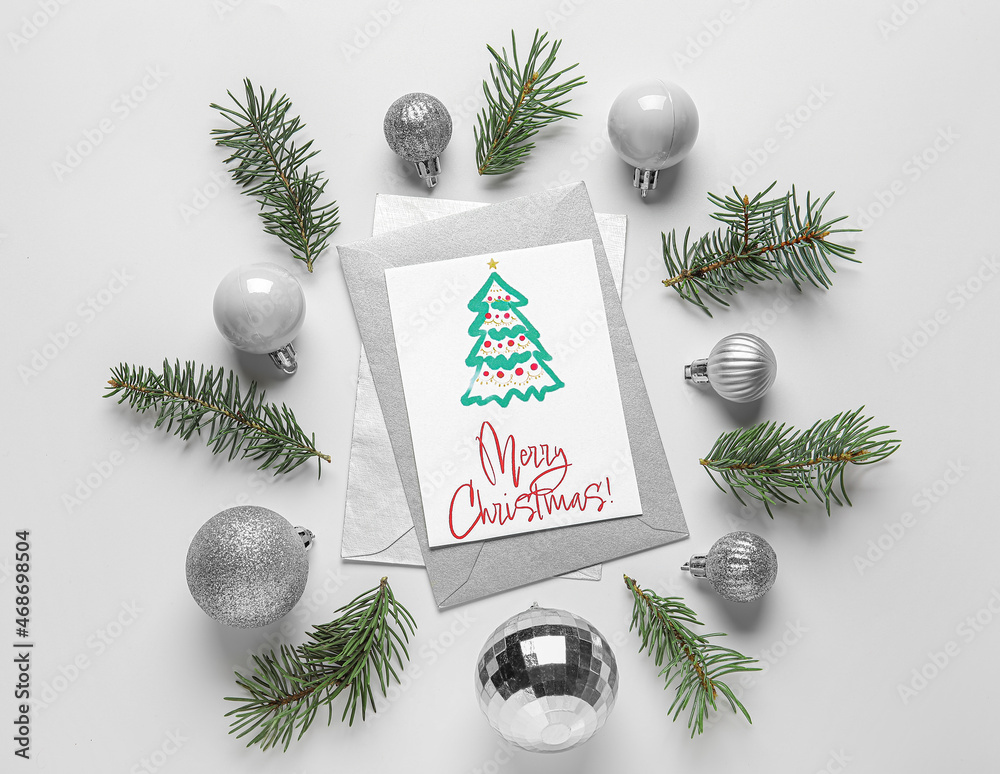 Greeting card with text MERRY Christmas, fir tree branches and balls on white background