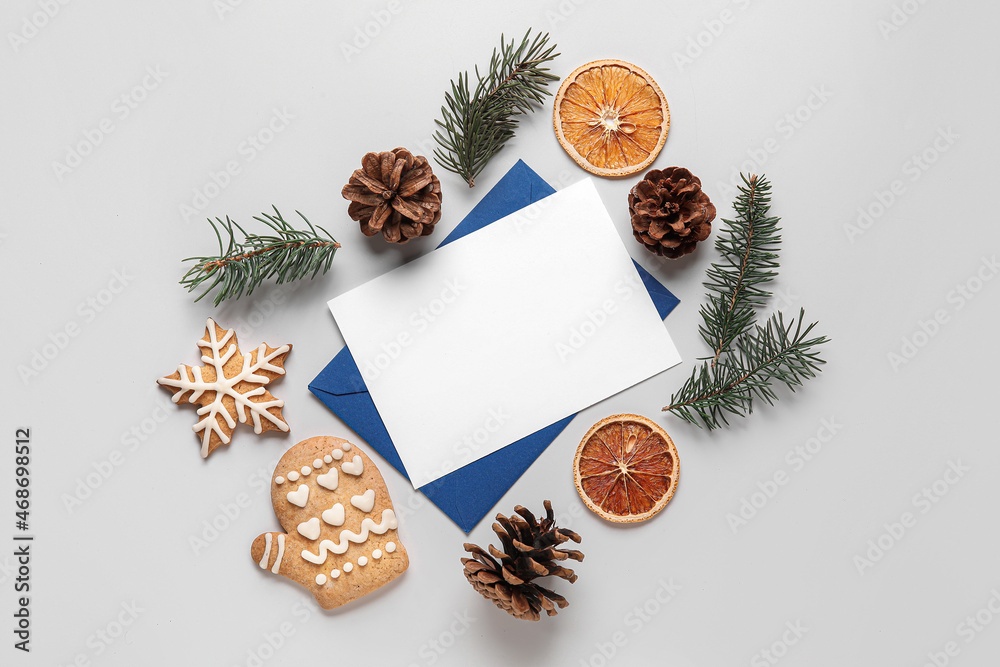 Blank card, fir tree branches and Christmas decor on white background