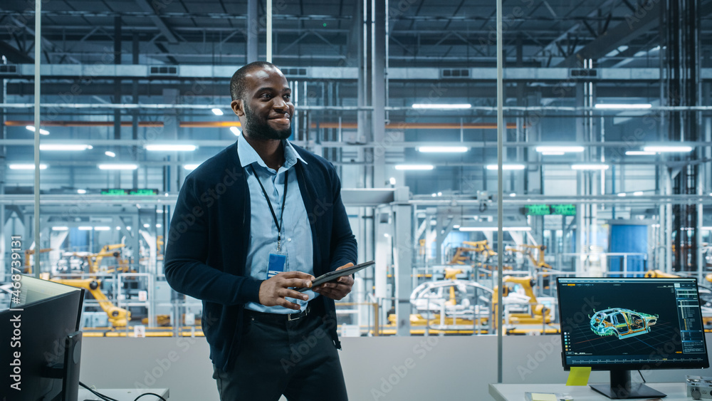 Car Factory Office: Successful Male Chief Engineer Overlooking Factory Production Conveyor. Automate