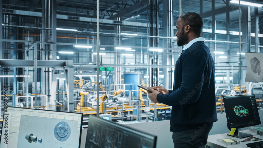 Car Factory Office: Portrait of Successful Black Male Chief Engineer Using Tablet Computer in Automa