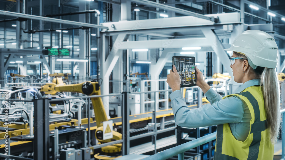 Car Factory: Female Automotive Engineer Using Augmented Reality Tablet Computer. Digitalization Scan