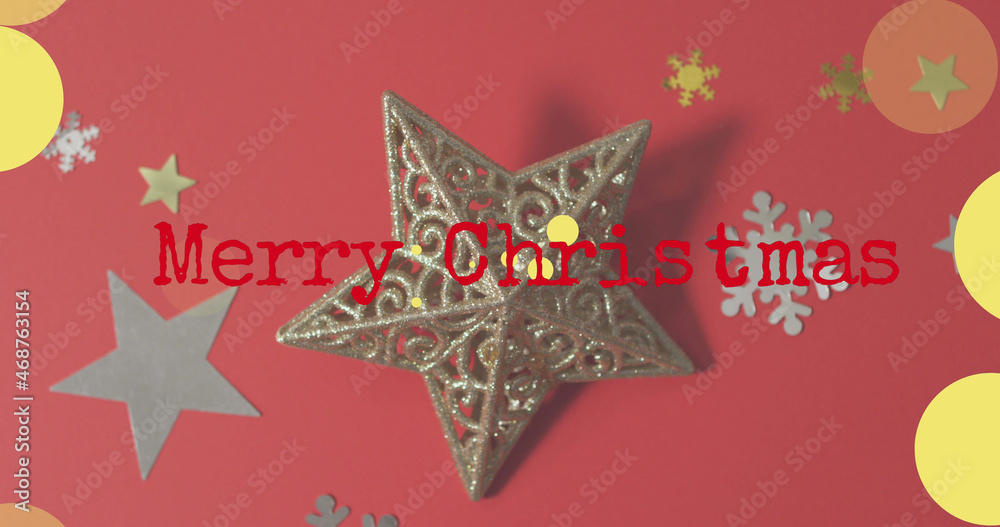 Image of merry christmas text over decorations on red background