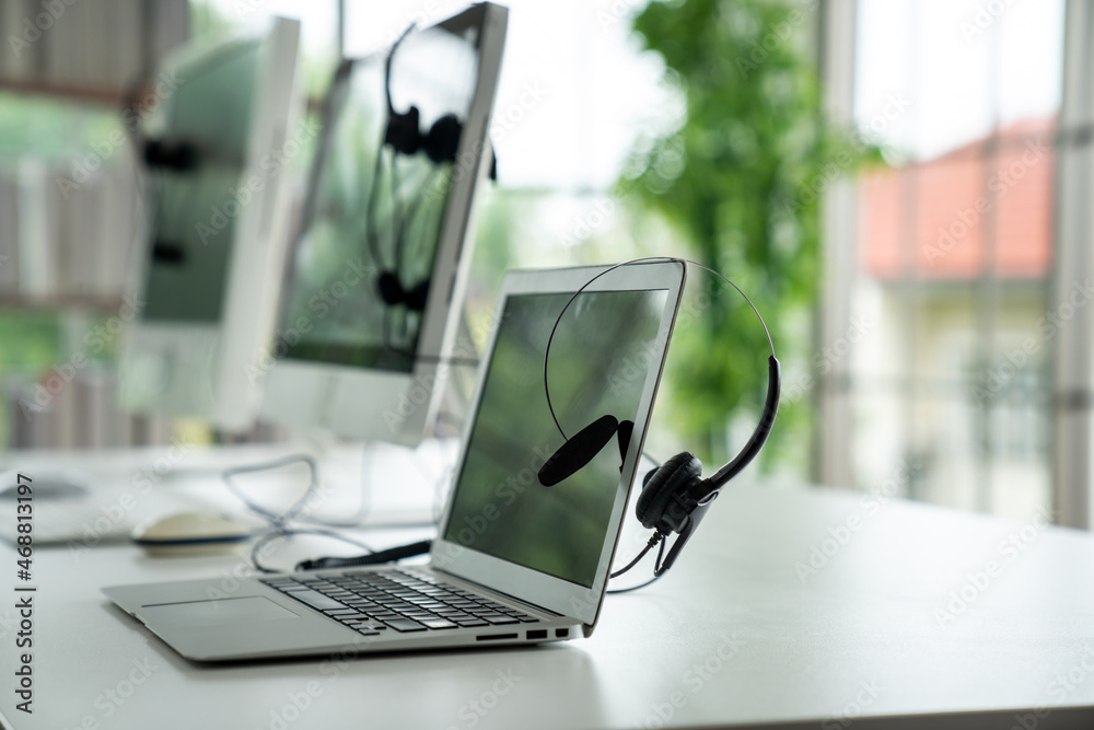 Headset and customer support equipment at call center ready for actively service . Corporate busines