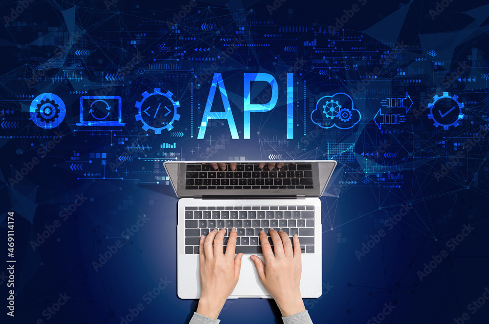 API - application programming interface concept with person using a laptop computer