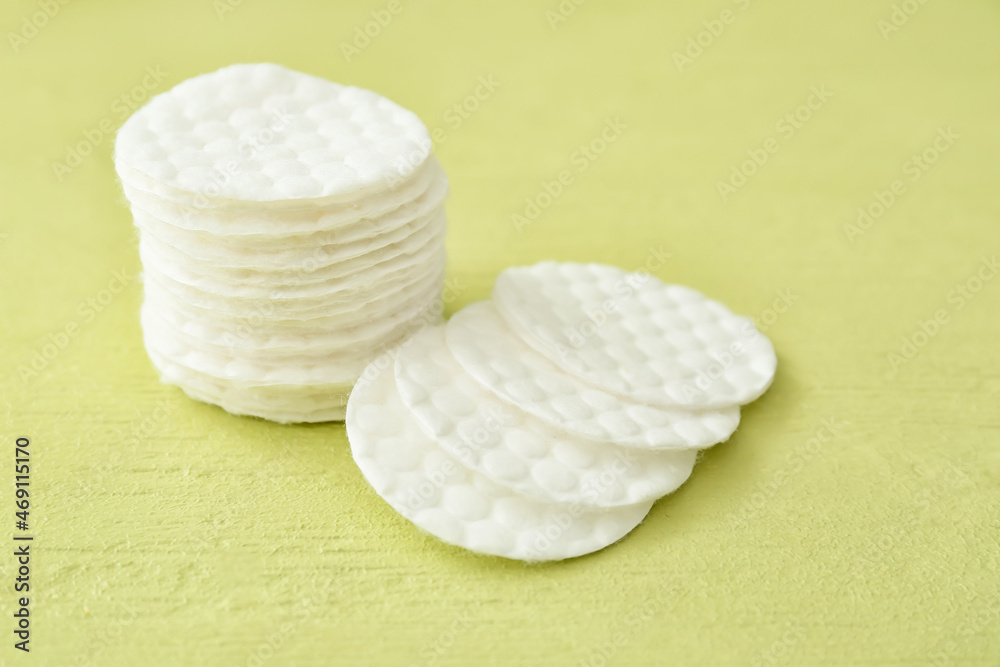 Clean cotton pads on color background, closeup