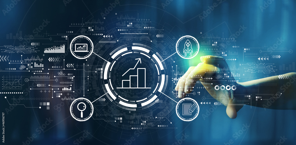 Business growth analysis with hand pressing a button on a technology screen