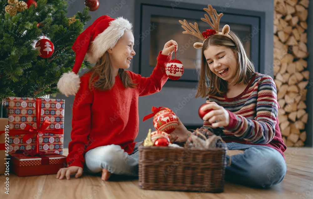 Kids are having fun near Christmas tree