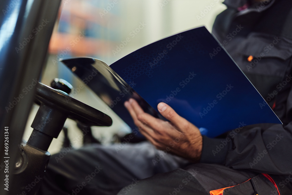 Picture of adult man, learning how to drive, at work