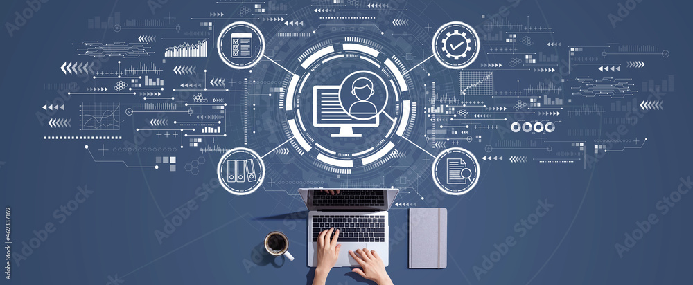 Document management system concept with person working with a laptop