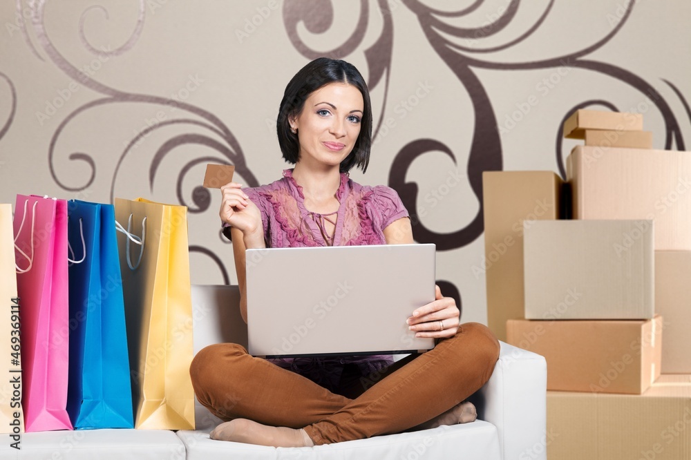 Young woman startup small business freelance with parcel box and computer laptop