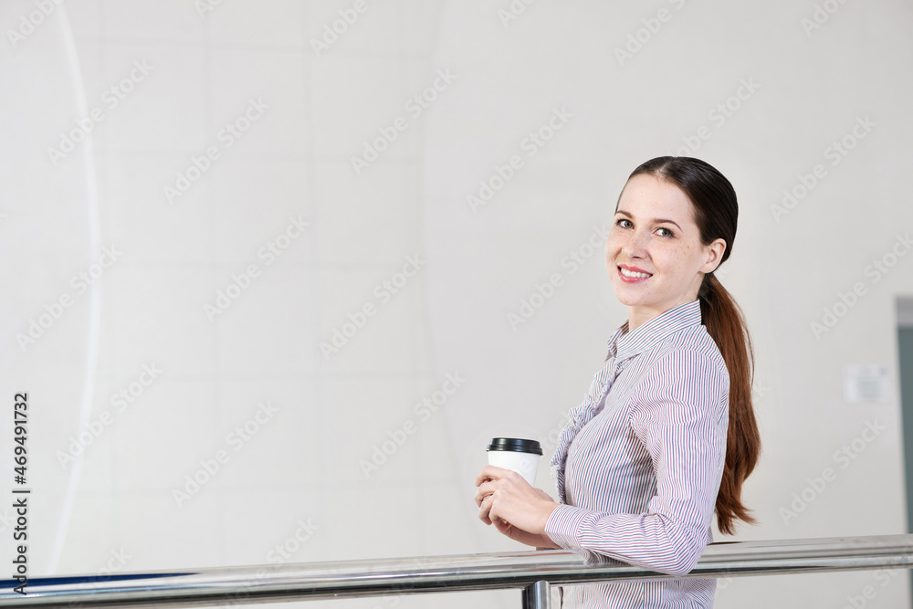 young attractive business woman with a cup of coffee