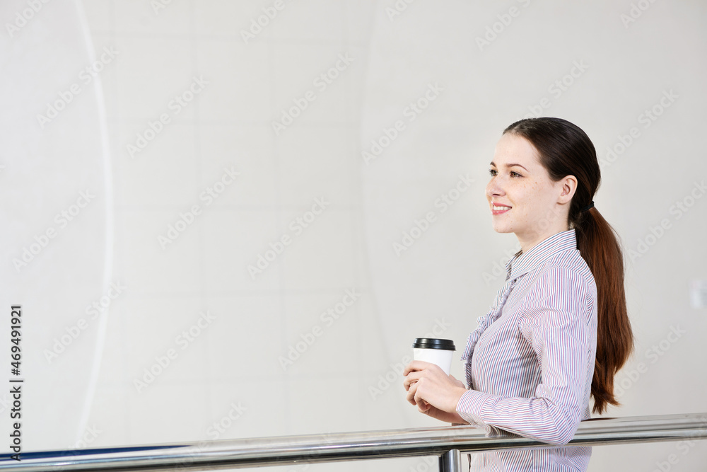 young attractive business woman with a cup of coffee