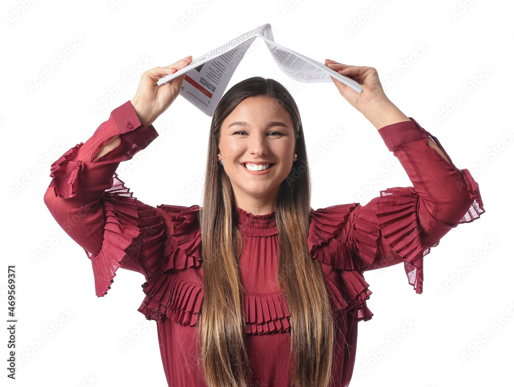 Smiling beautiful woman in red blouse with newspaper on white background