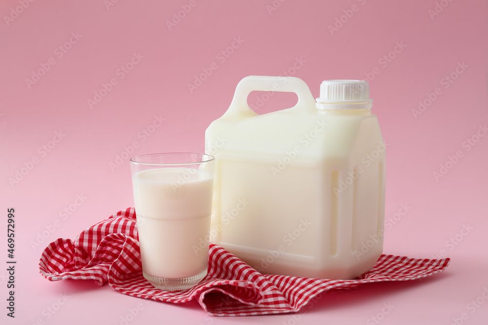 Gallon bottle of milk on pink background