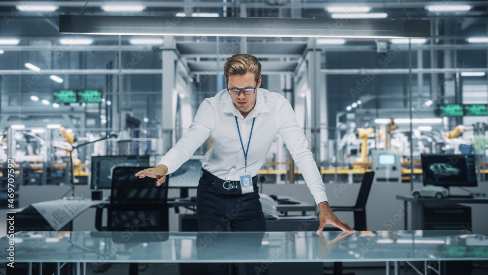 Confident Engineer in White Shirt Making Gestures of Moving Invisible Object in Virtual Reality in a