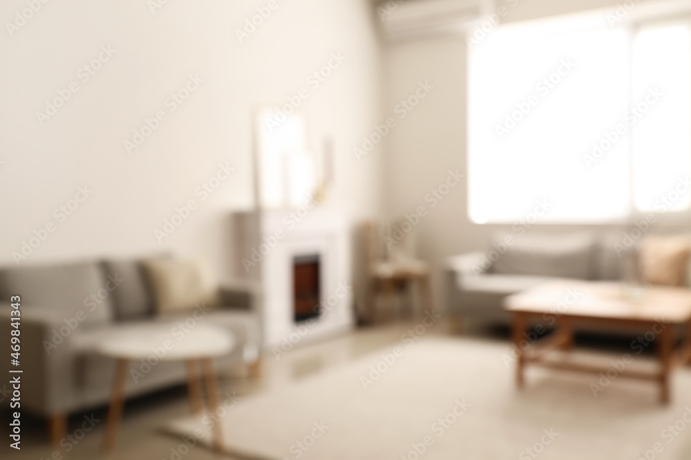 Stylish interior of living room, blurred view