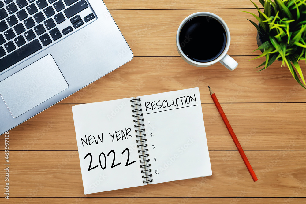 2022 Happy New Year Resolution Goal List and Plans Setting - Business office desk with notebook writ