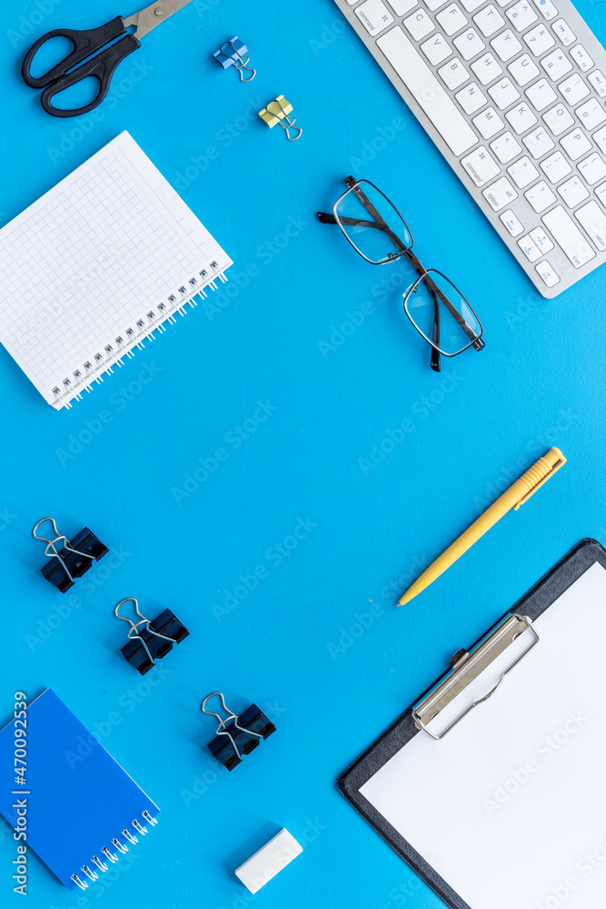 Office or home workspace with computer keyboard. Top view