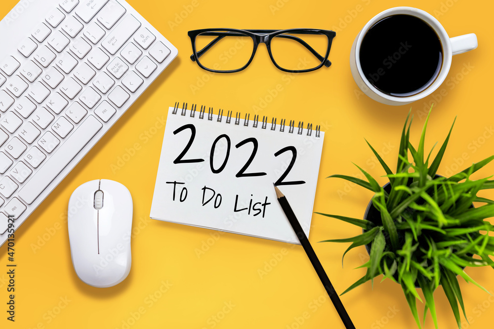 2022 Happy New Year Resolution Goal List and Plans Setting - Business office desk with notebook writ