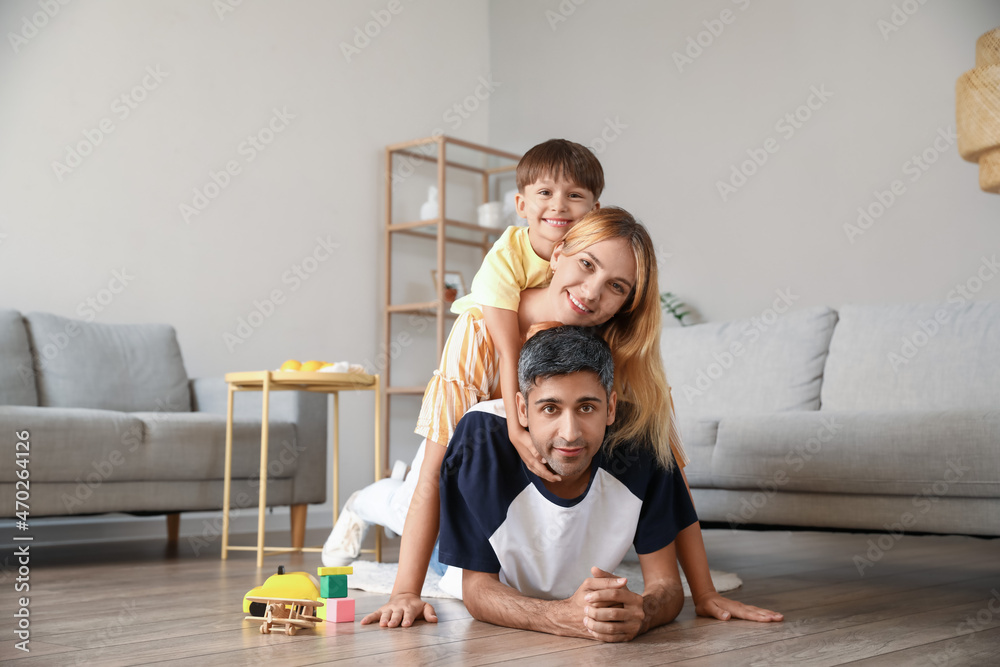 Little boy and his parents at home