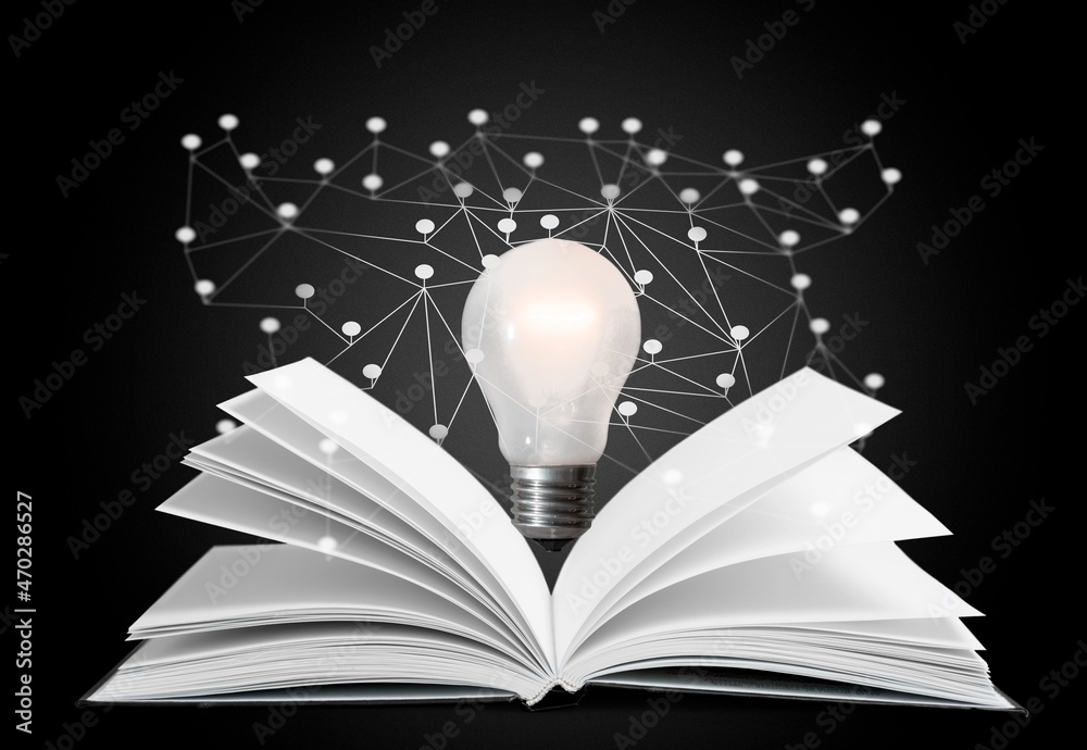 Light bulbs and books. Concept of reading books, knowledge, and new ideas.