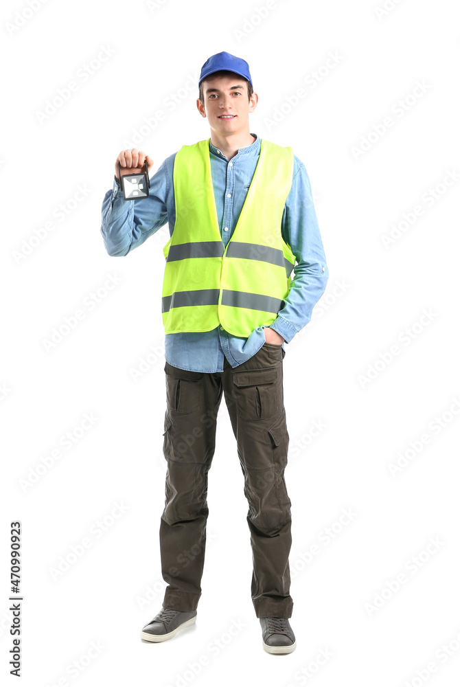 Young male worker with flashlight on white background