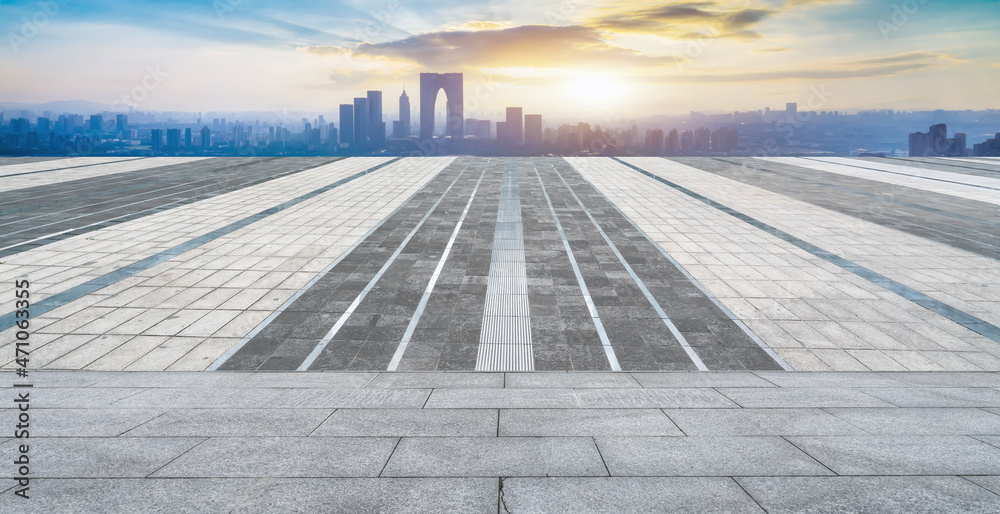 Empty brick floor with city skyline background