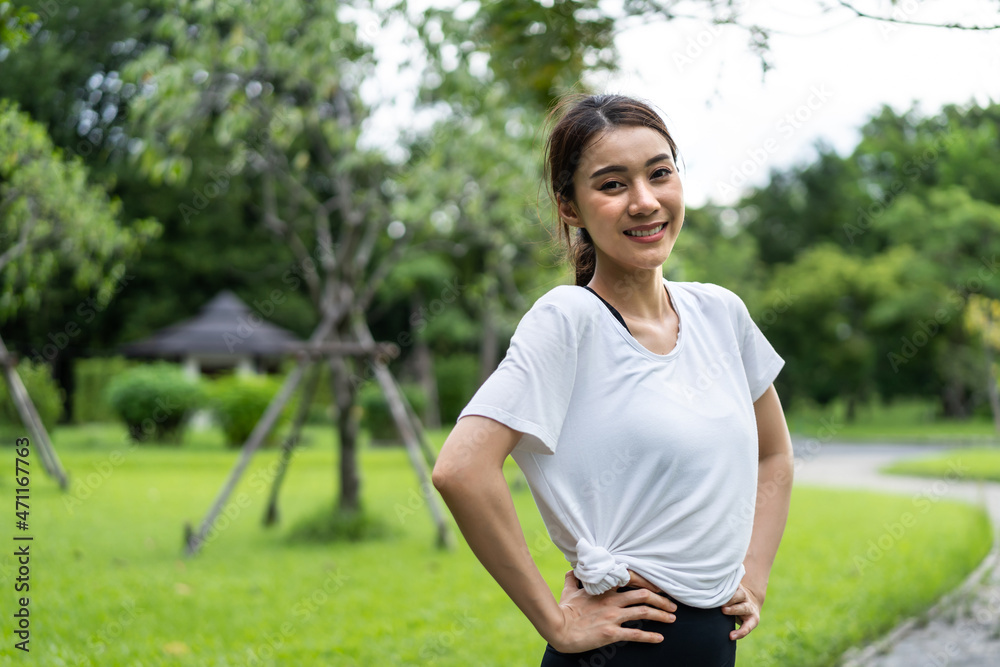 Asian active sport woman stand with confidence after exercise outdoors. 